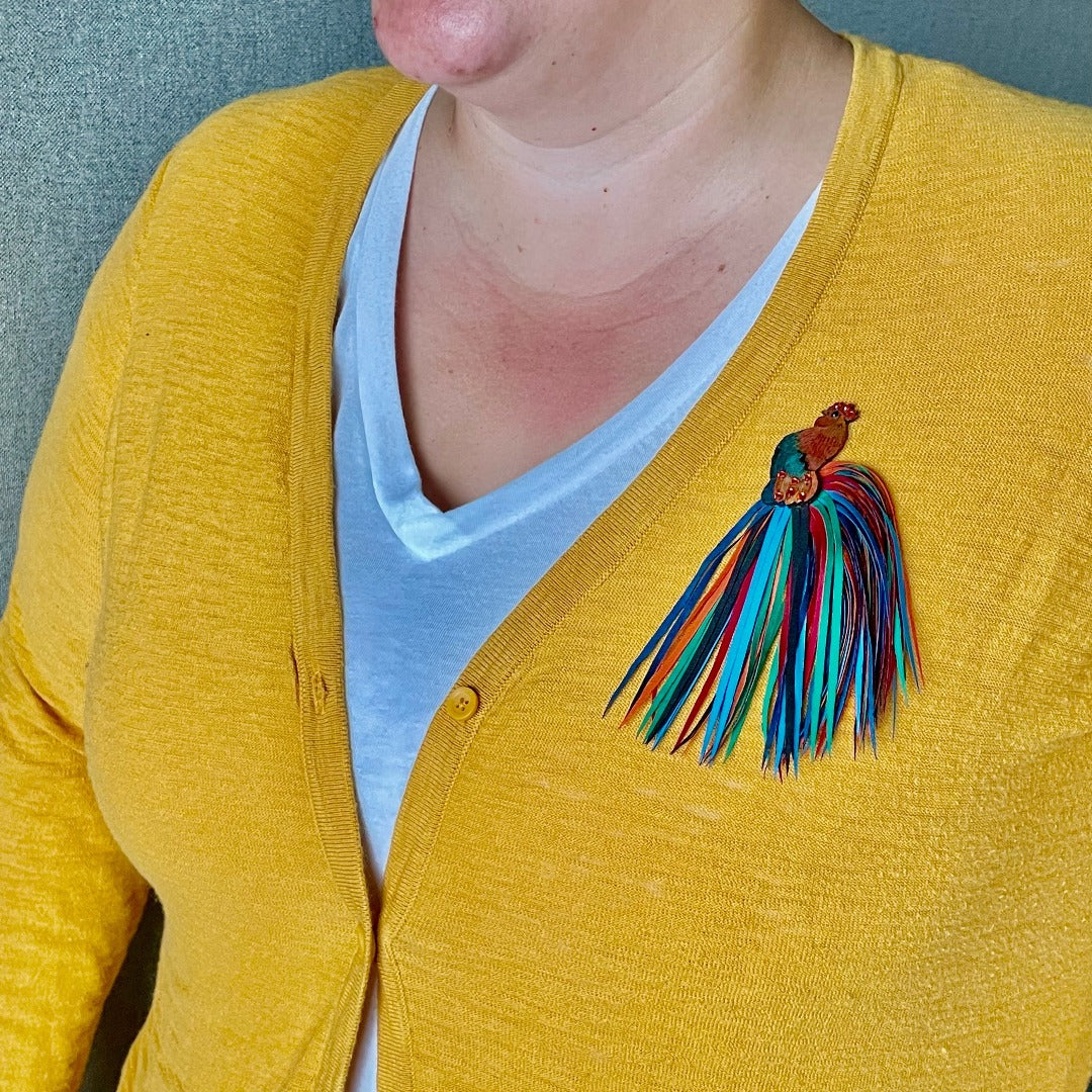 Rooster Brooch on model wearing a yellow sweater.