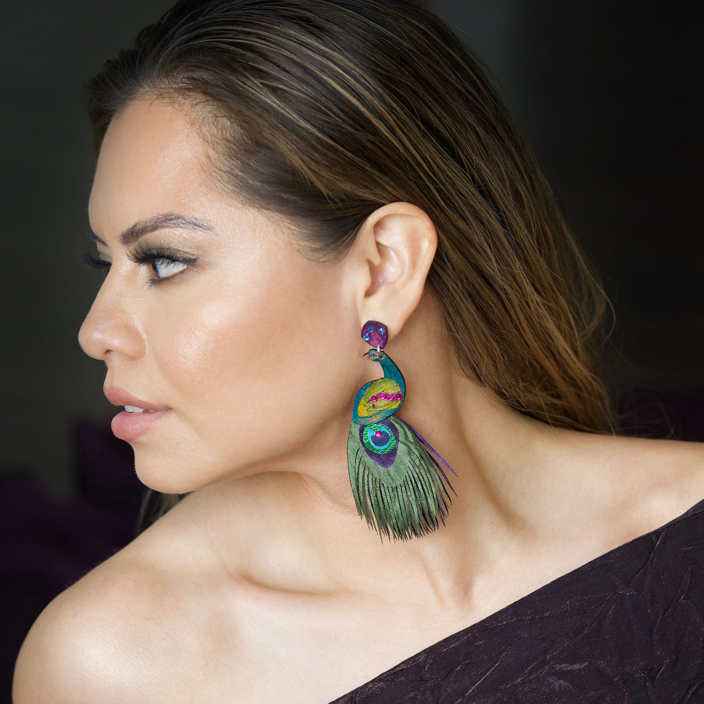 Woman wearing XL Peacock Earrings