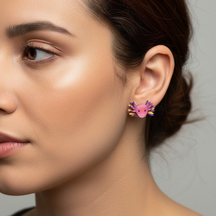 Close-up of a woman wearing pink earrings with a neutral background