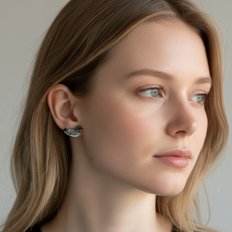 Woman wearing earrings with a neutral background