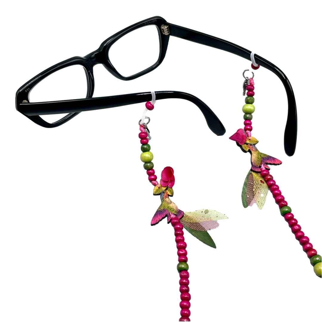 Pink anna hummingbird chain for eyeglasses or facemasks.  Chain is attached to black frame glasses.  Handmade in Colombia. 