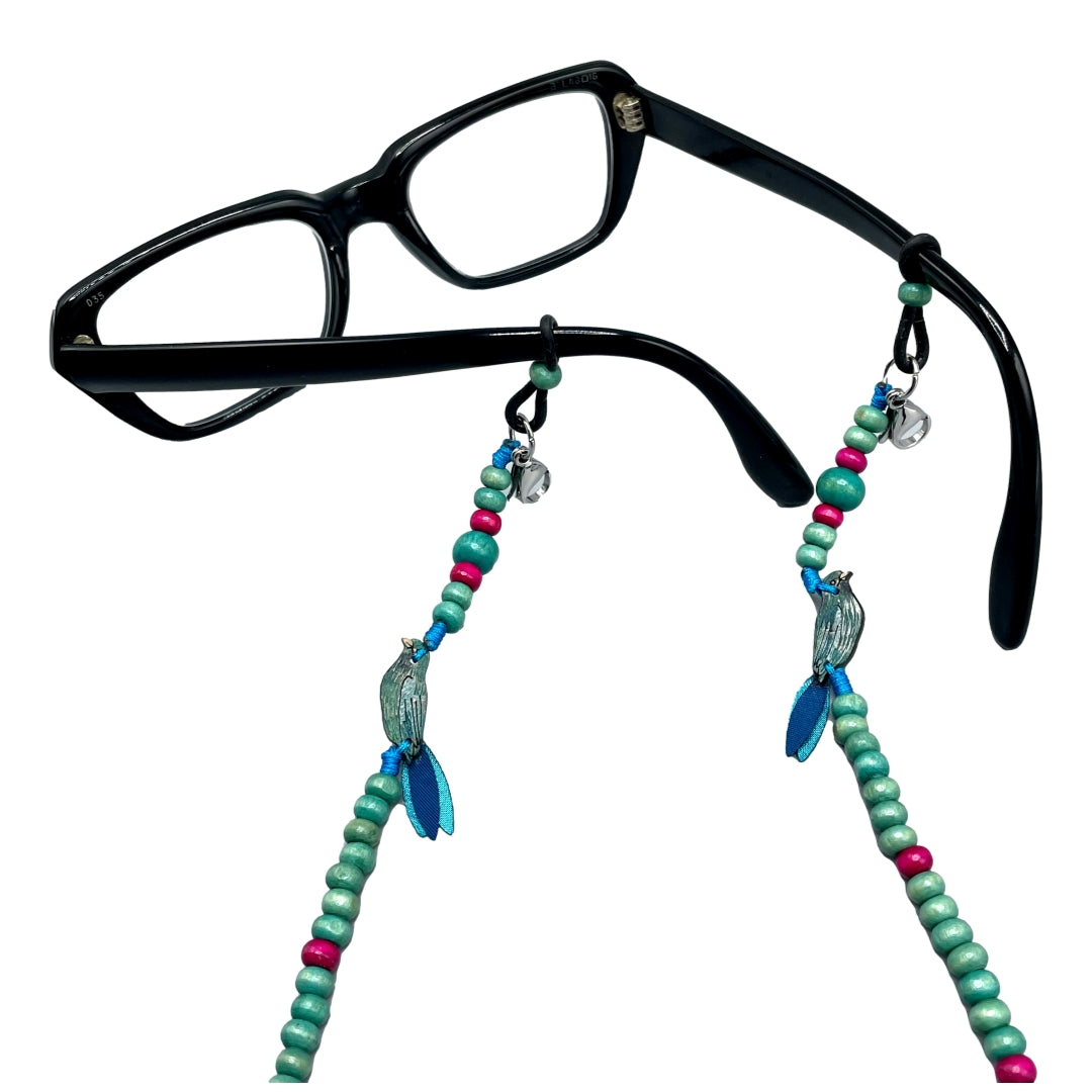 Blue Bird chain for eyeglasses attached to black frame glasses.  Handmade in Colombia.