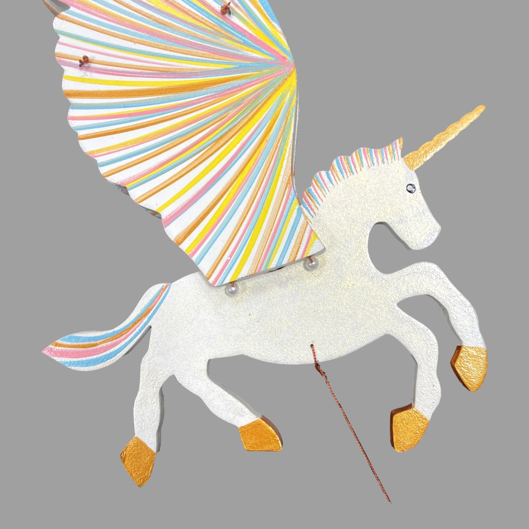 Unicorn Alicorn flying mobile.  Detail of white body with golden shimmer.  Handmade In Colombia. 