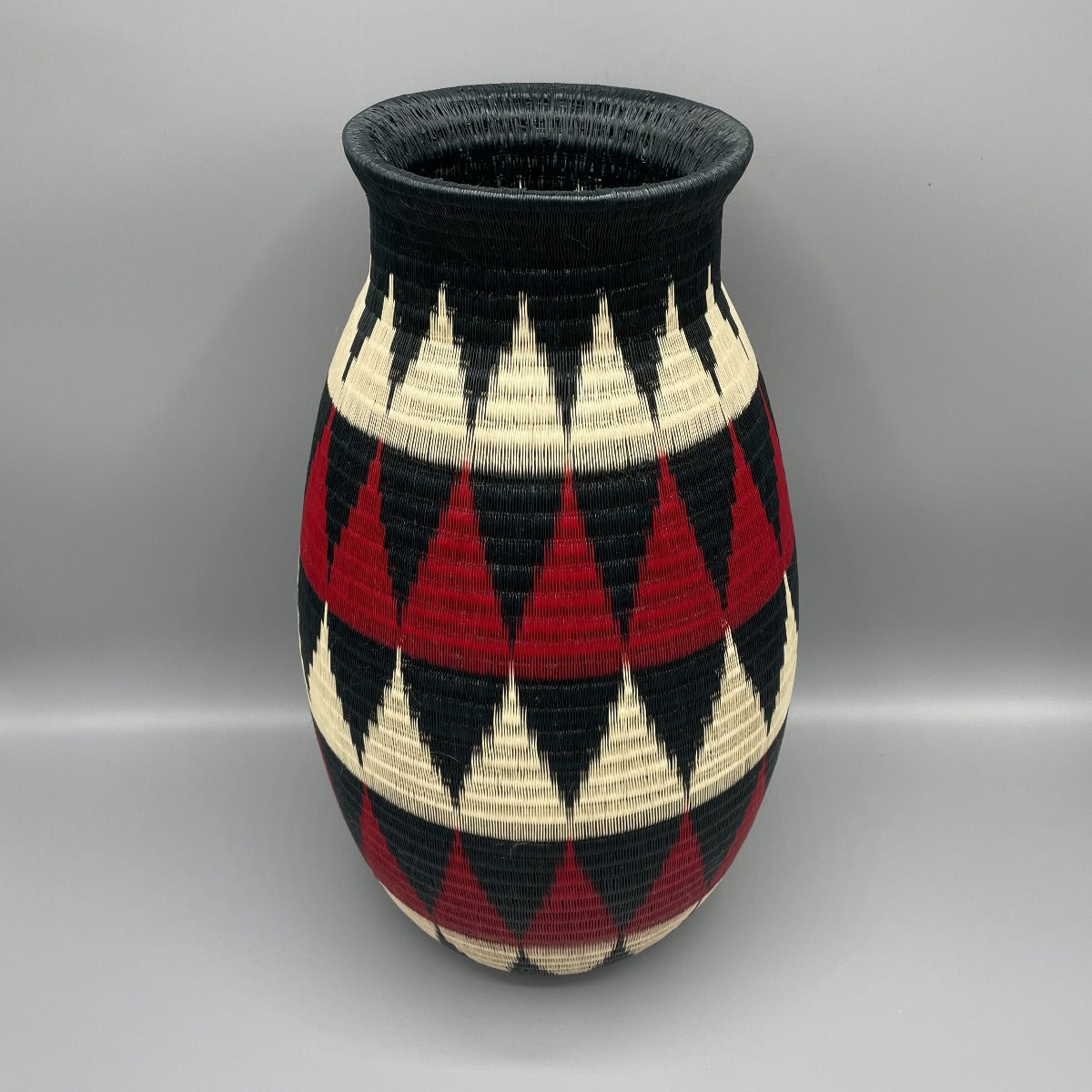 wounaan fine art vase basket.  Handmade in Colombia.  Mountain design in black, Red, & beige. 
