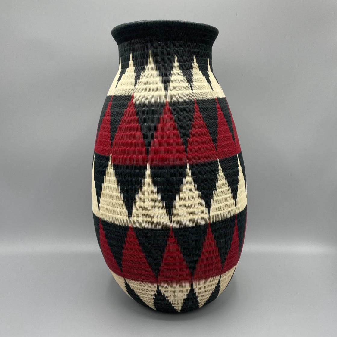 wounaan fine art vase basket.  Handmade in Colombia.  Mountain design in black, Red, & beige. 