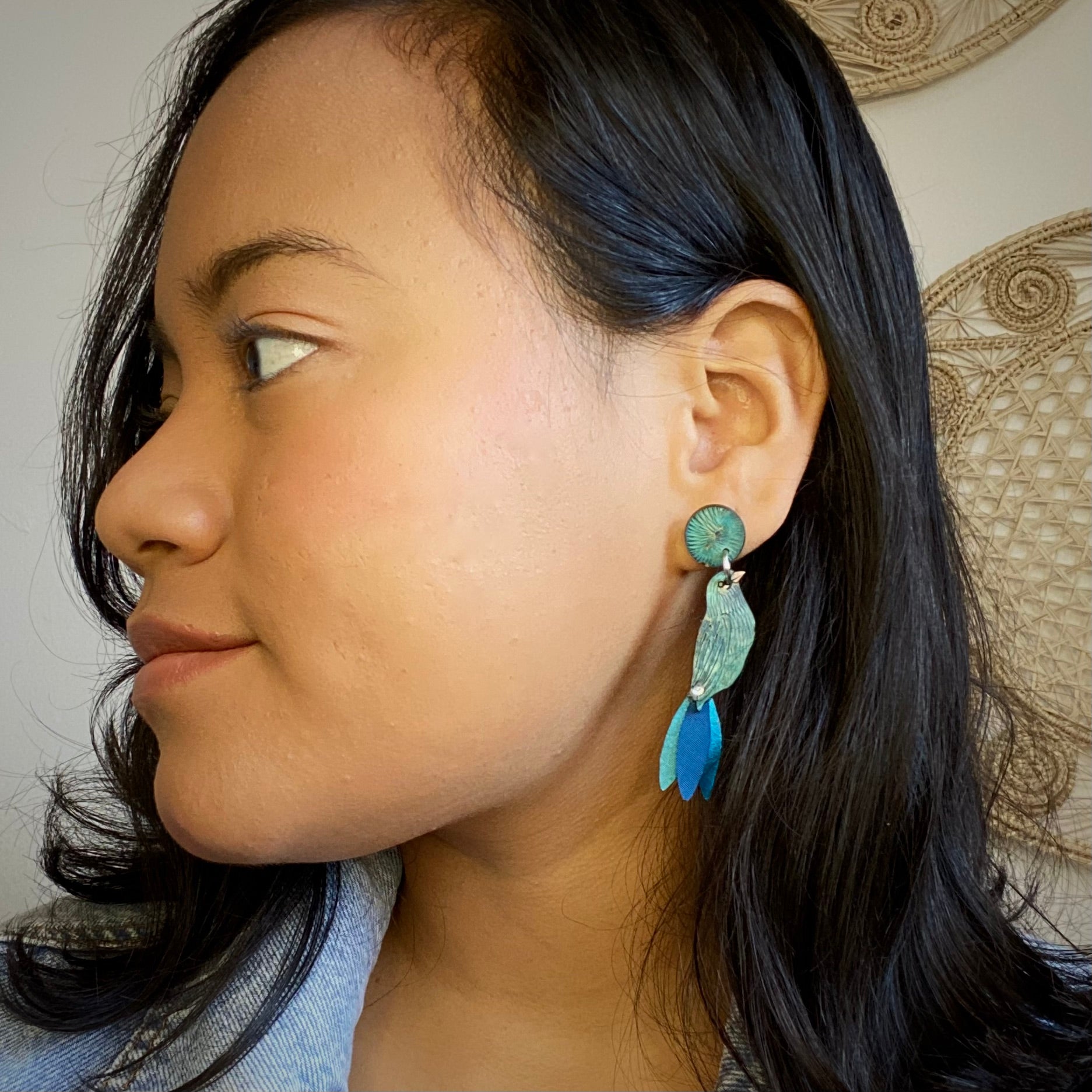 Blue Bird Lg Earrings on Model.  Handmade in Colombia.